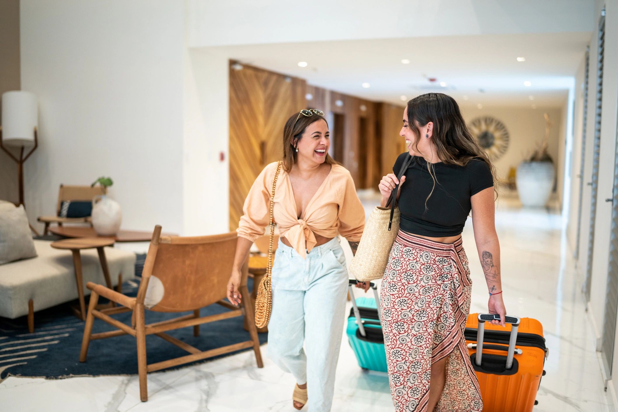 Travelers arriving at a hotel with luggage