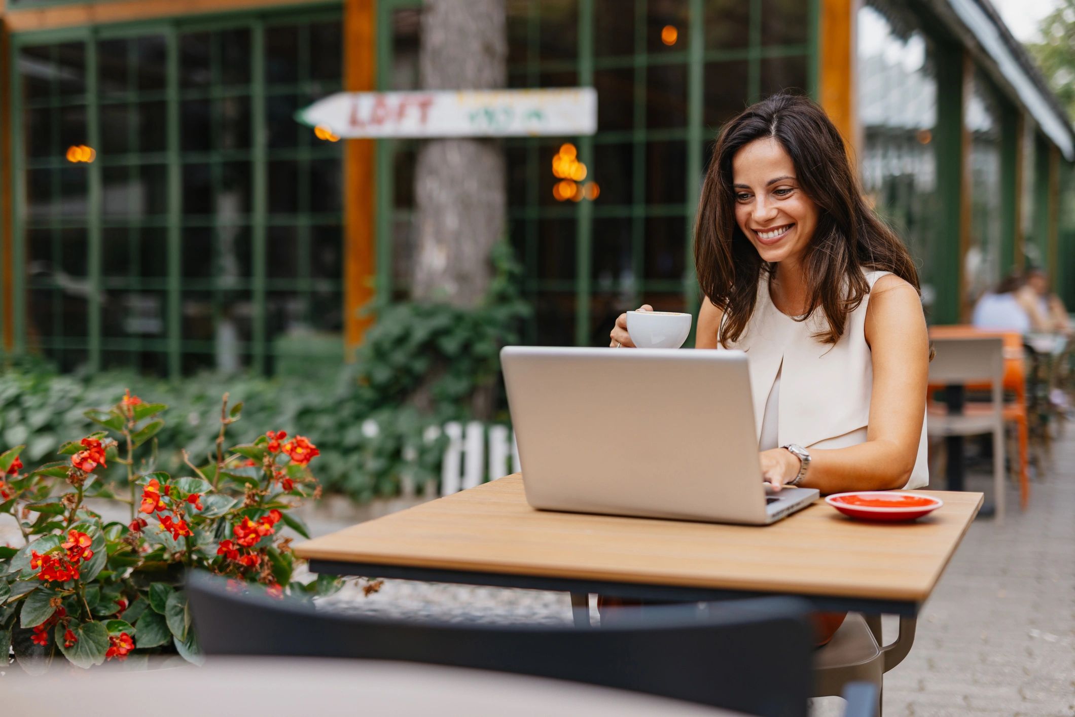 Digital nomad working on a laptop while planning travel